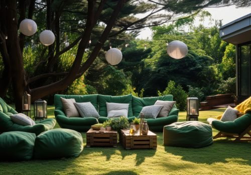 Grassy outdoor area featuring a movie screen and comfy bean bags Grassy outdoor area featuring a movie screen and comfy bean bags.